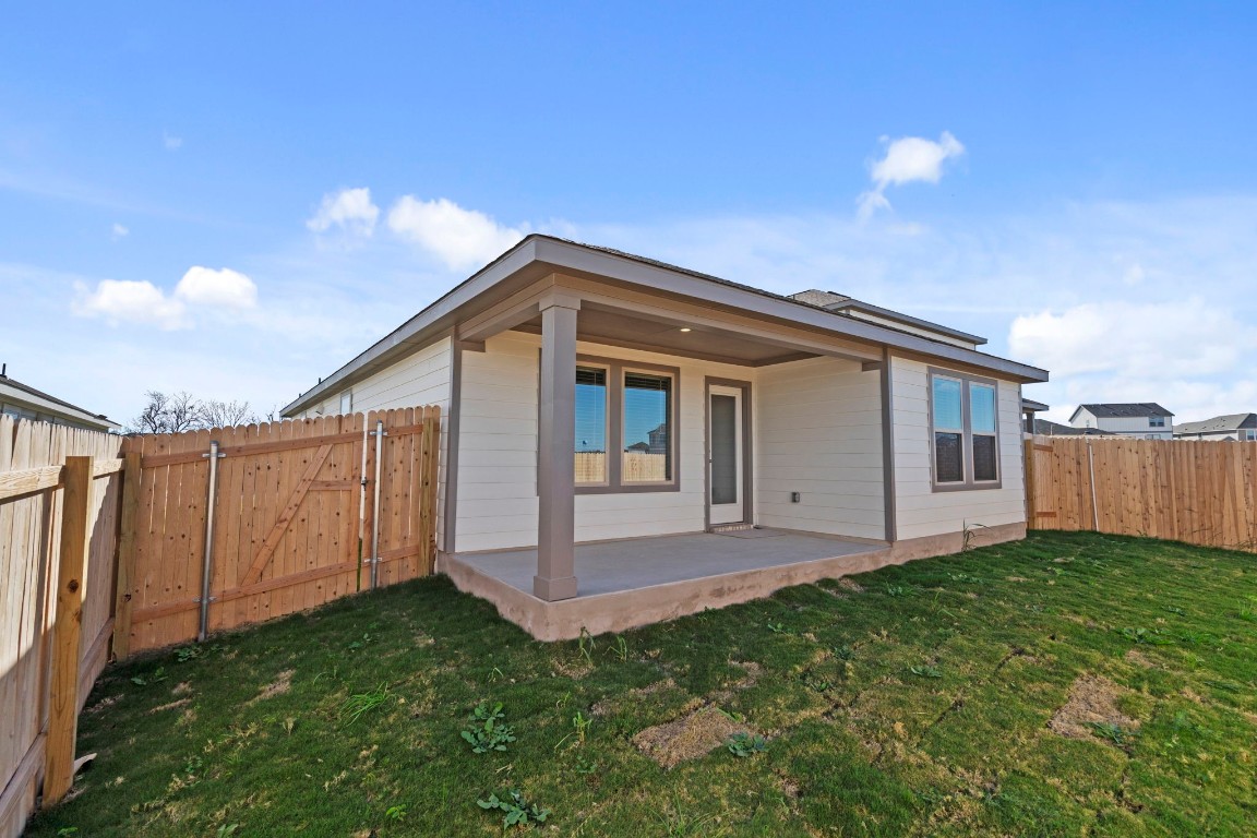 125 Hatari Trail Jarrell, TX 76537 - Photo 26 of 40 a view of backyard with small cabin