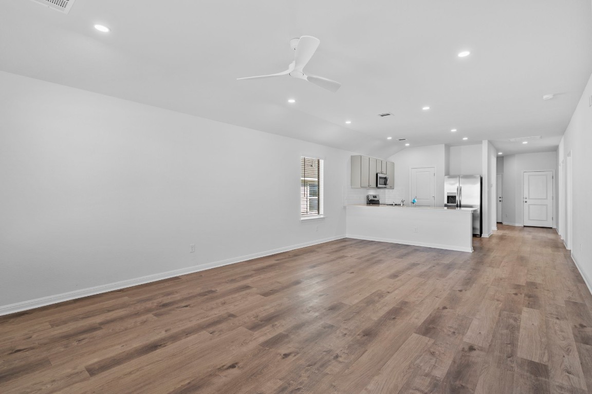 125 Hatari Trail Jarrell, TX 76537 - Photo 7 of 40 a view of a kitchen with a sink stainless steel appliances and cabinets