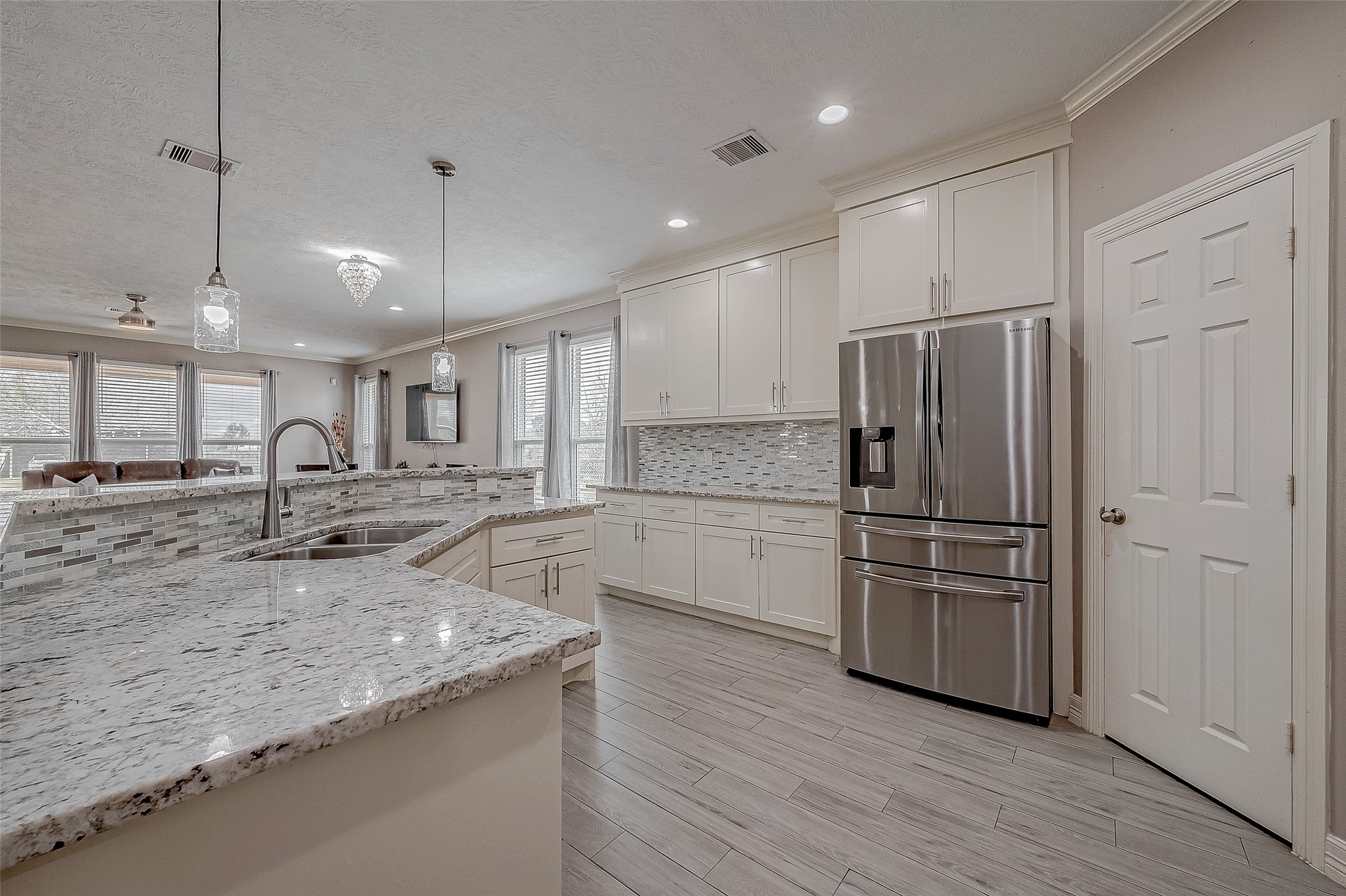 709 Coen Road Rosharon, TX 77583 - Photo 14 of 33 a kitchen with a refrigerator and a sink
