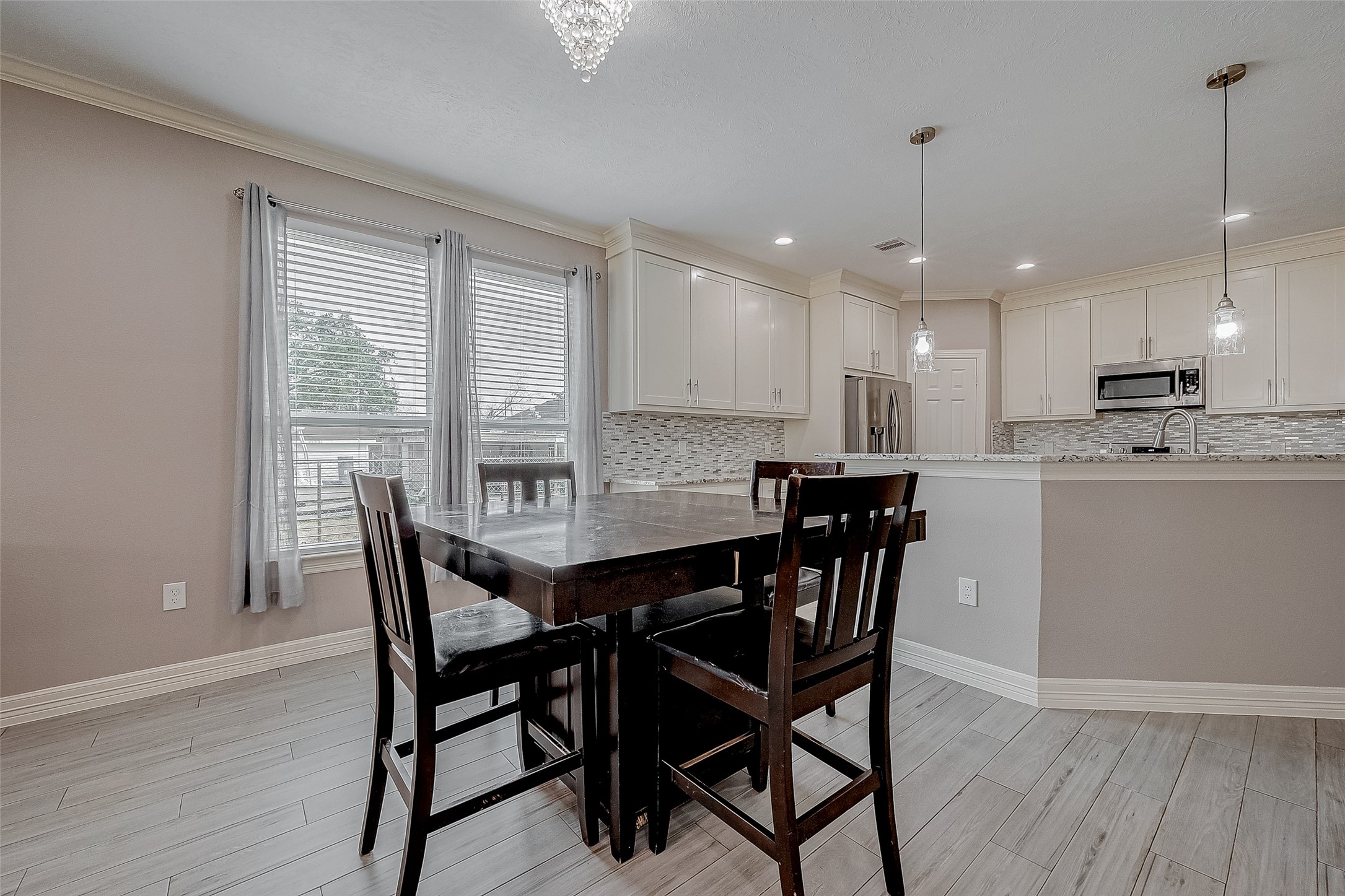 709 Coen Road Rosharon, TX 77583 - Photo 14 of 33 a view of a dining room with furniture window and wooden floor