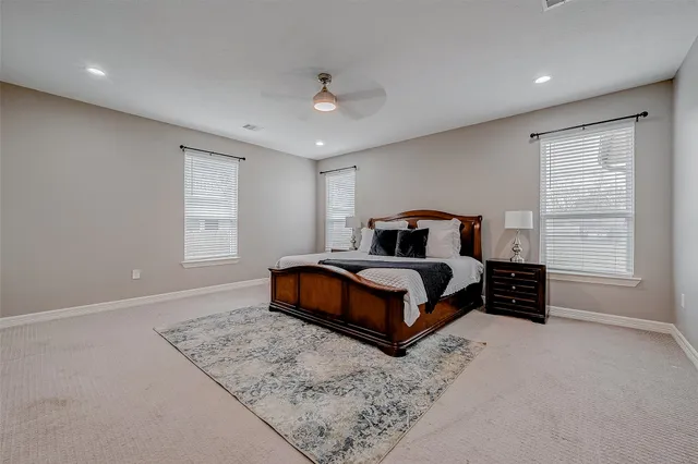 a bedroom with a bed and window