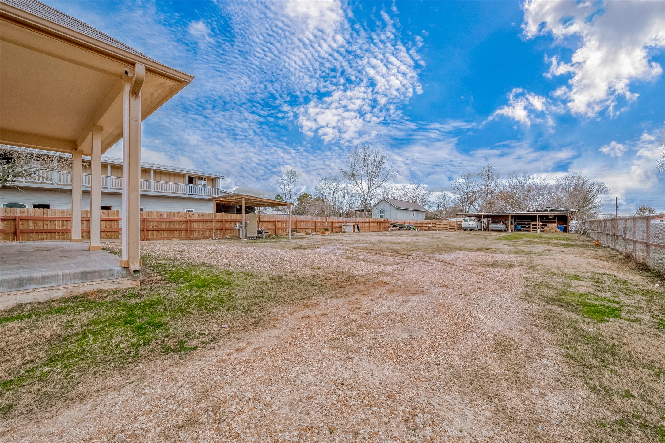 709 Coen Road Rosharon, TX 77583 - Photo 25 of 33 a view of a yard with wooden fence
