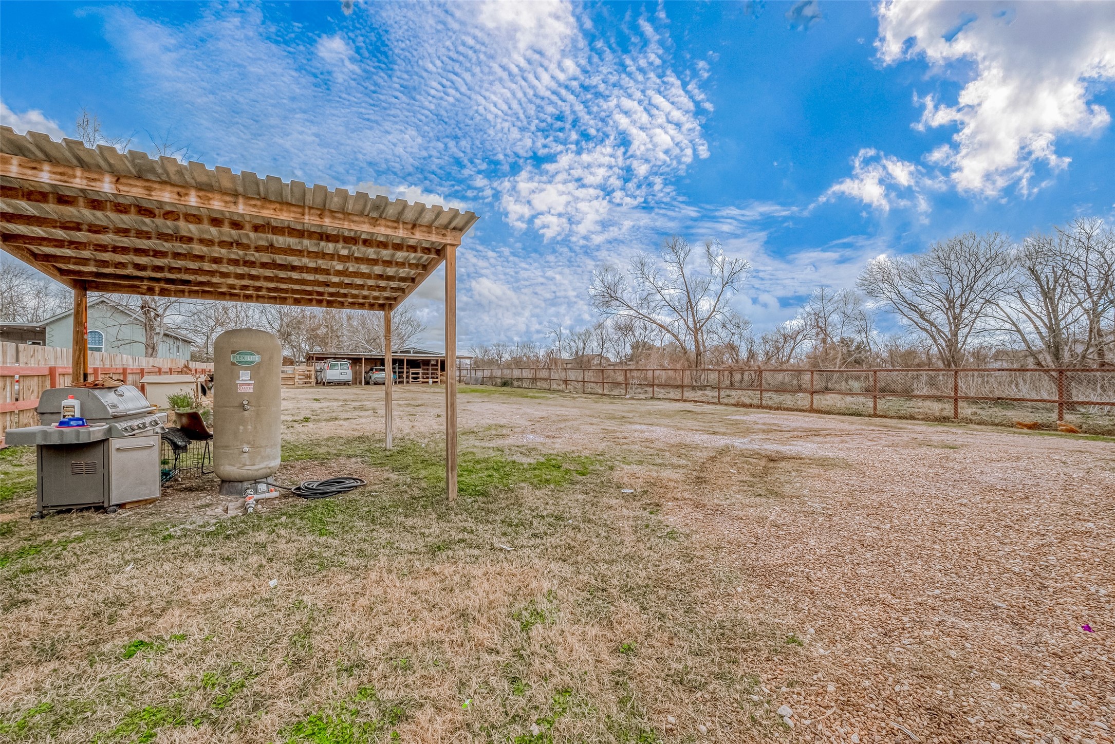 709 Coen Road Rosharon, TX 77583 - Photo 26 of 33 a backyard of a house with lots of green space
