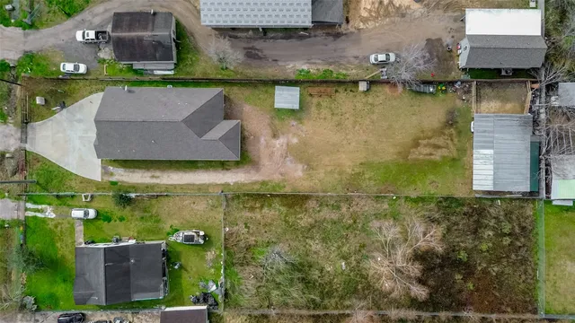 an aerial view of a residential houses with outdoor space