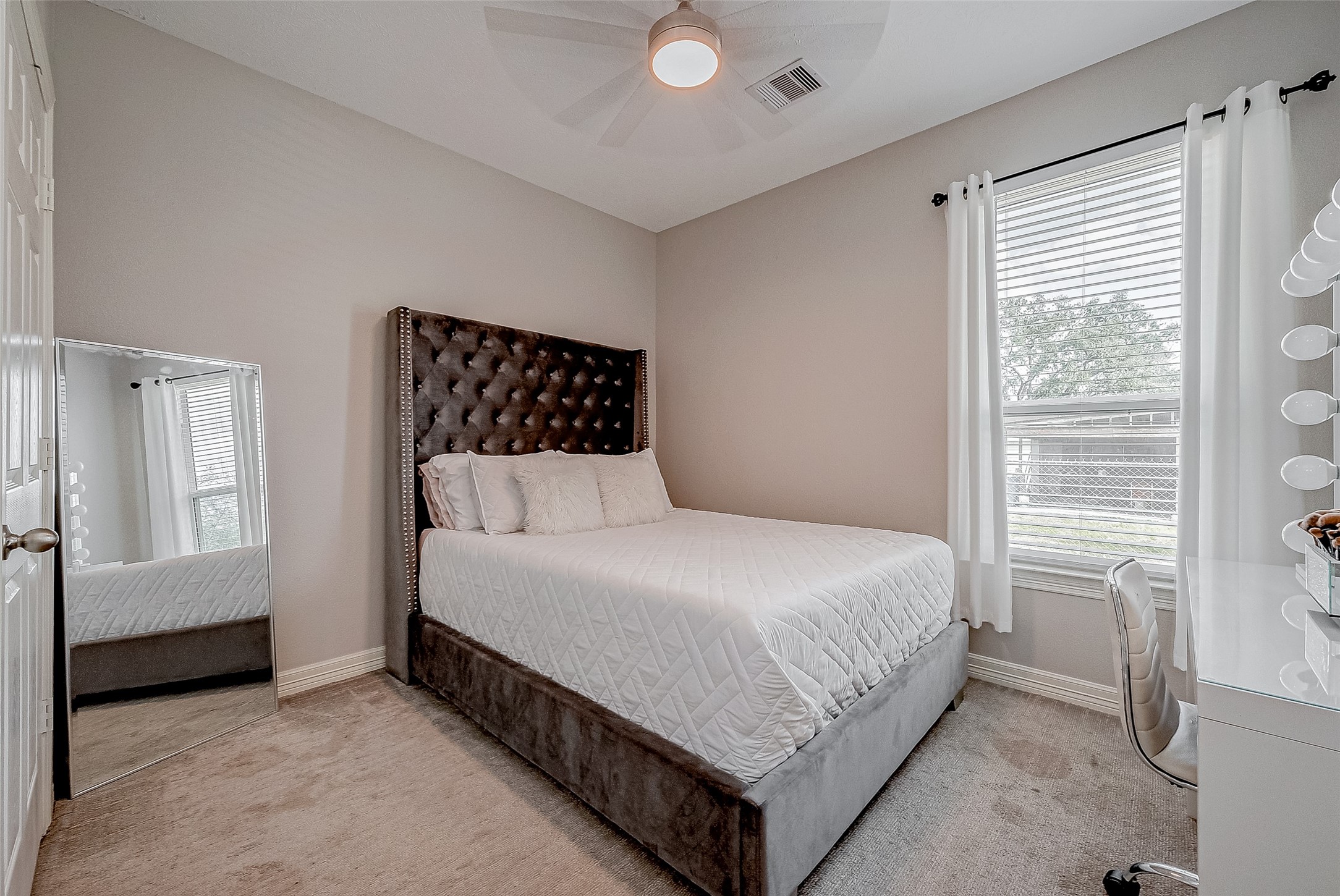 709 Coen Road Rosharon, TX 77583 - Photo 10 of 33 a bedroom with a bed and window