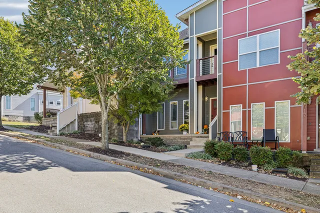a view of a brick building next to a road
