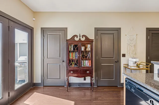 a kitchen with counter top space and wooden floor