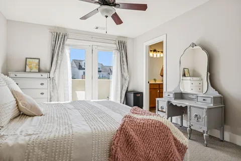 a bedroom with a bed lamps and a furniture