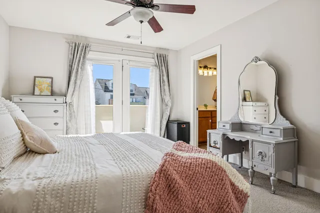 a bedroom with a bed lamps and a furniture