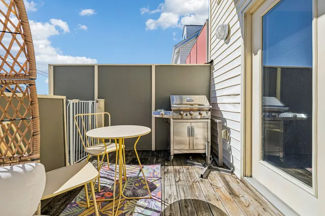 a view of a chair and table in the balcony