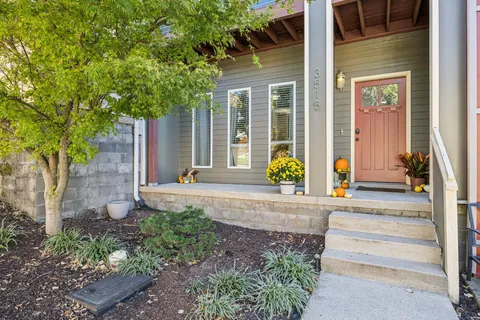 a front view of a house with garden