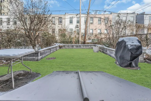 a view of a dining room with furniture and a chandelier