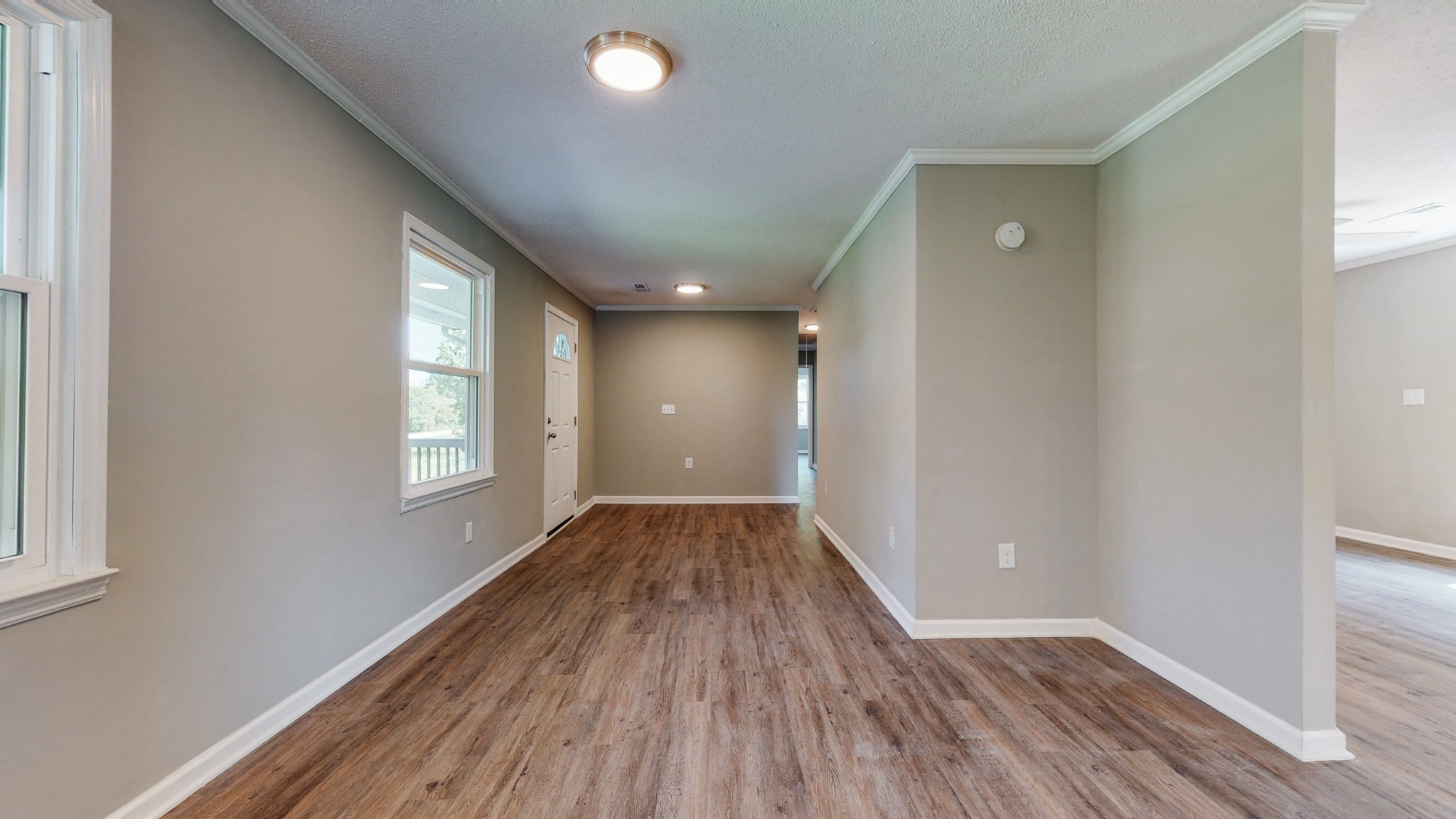 28 Providence Road Fayetteville, TN 37334 - Photo 12 of 48 an empty room with wooden floor and windows