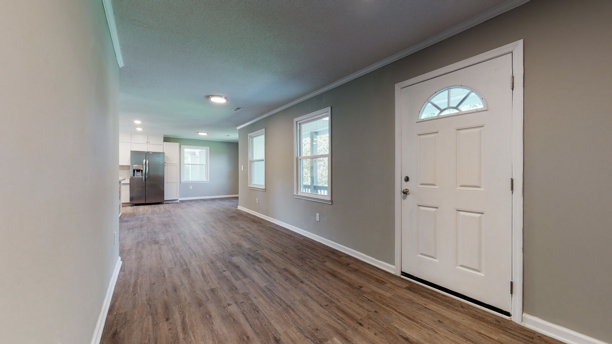 28 Providence Road Fayetteville, TN 37334 - Photo 13 of 48 an empty room with wooden floor cabinet and windows