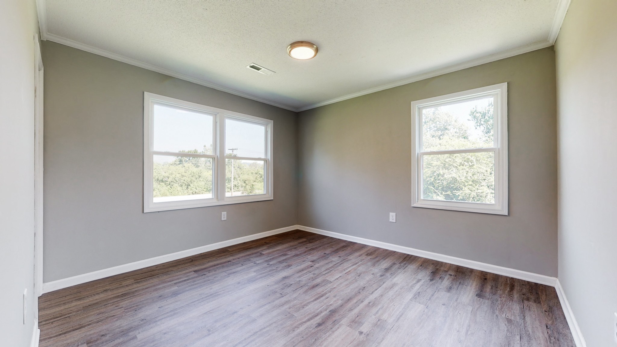 28 Providence Road Fayetteville, TN 37334 - Photo 19 of 48 a view of an empty room with wooden floor and a window