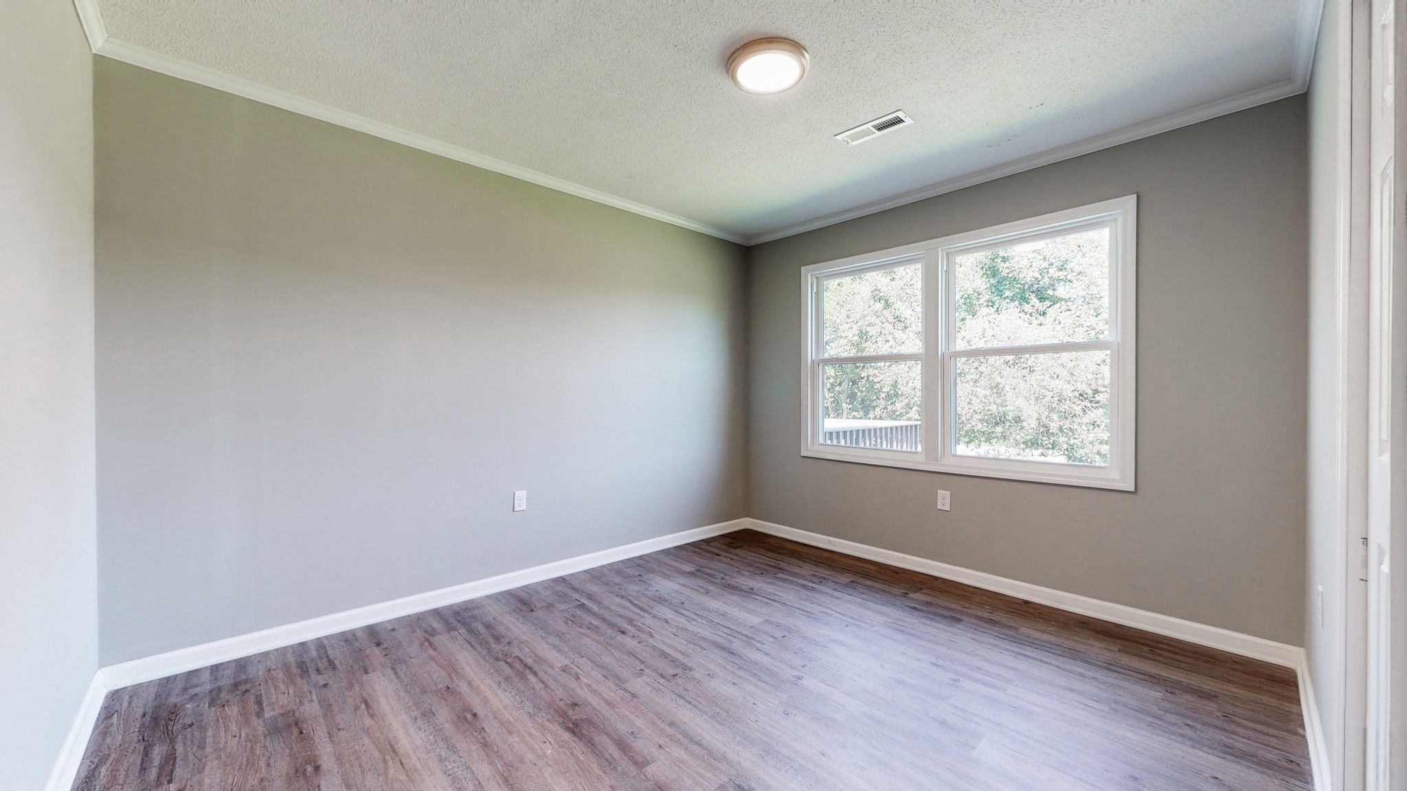 28 Providence Road Fayetteville, TN 37334 - Photo 21 of 48 an empty room with wooden floor and windows