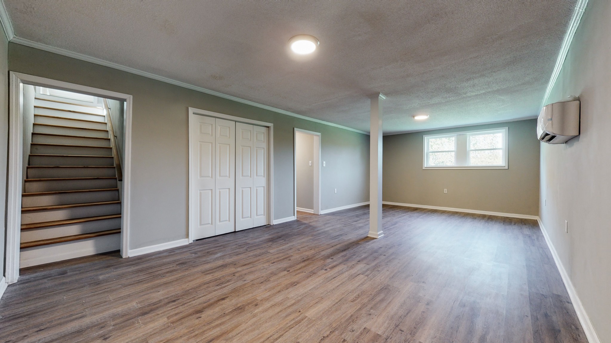 28 Providence Road Fayetteville, TN 37334 - Photo 25 of 48 an empty room with wooden floor cabinet and windows