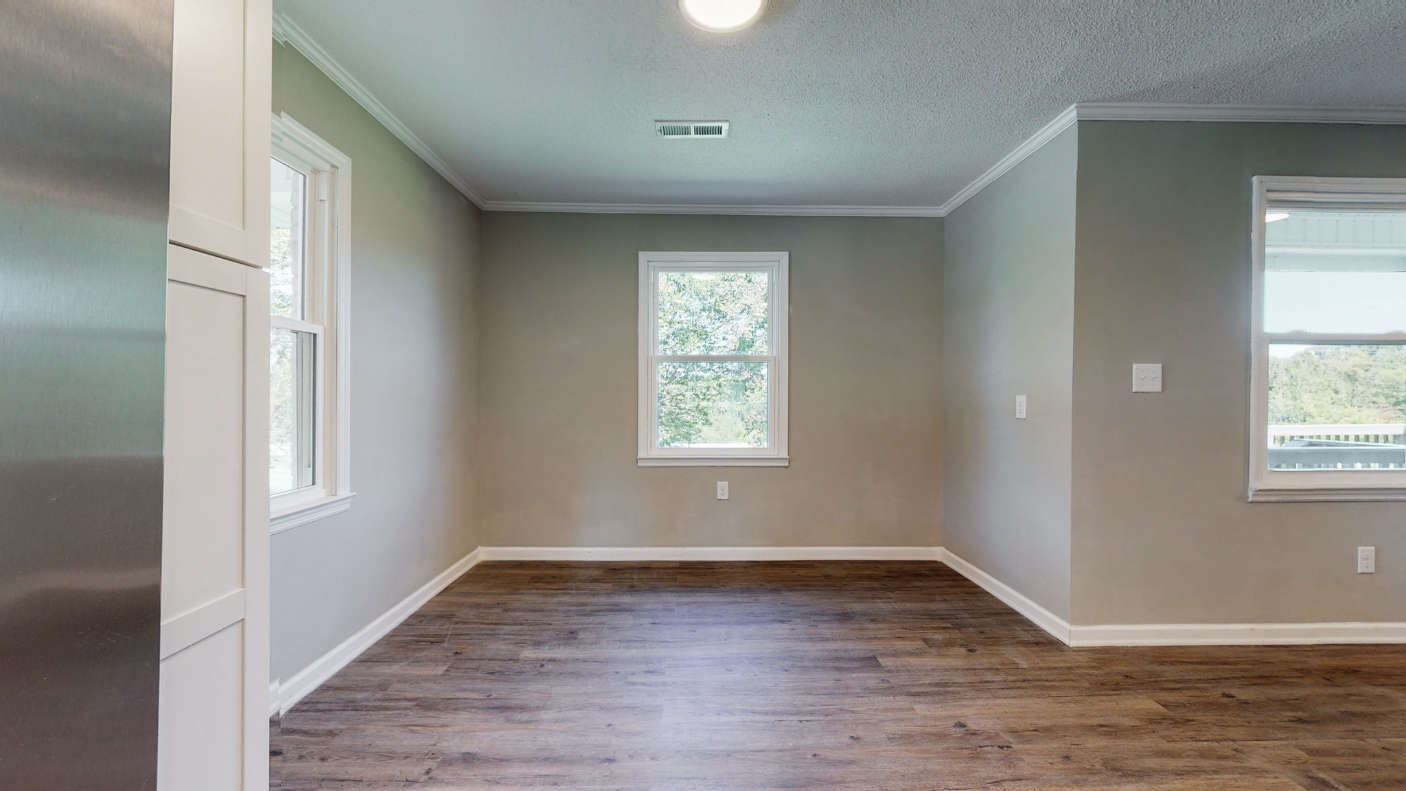 28 Providence Road Fayetteville, TN 37334 - Photo 8 of 48 an empty room with wooden floor and windows