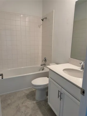 a bathroom with a sink a toilet and a bathtub
