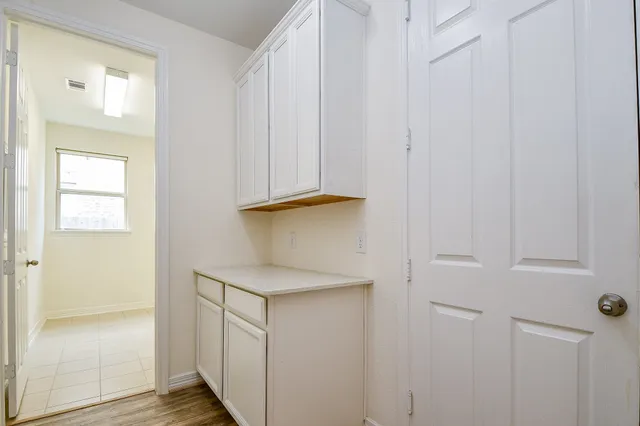 a view of storage and utility room with closet