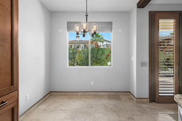 a bathroom with a granite countertop sink toilet a mirror and shower
