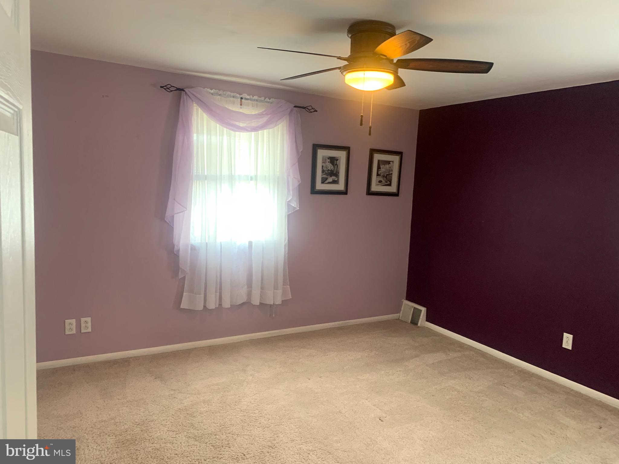 9902 Medway Road Philadelphia, PA 19115 - Photo 11 of 28 an empty room with windows and fan