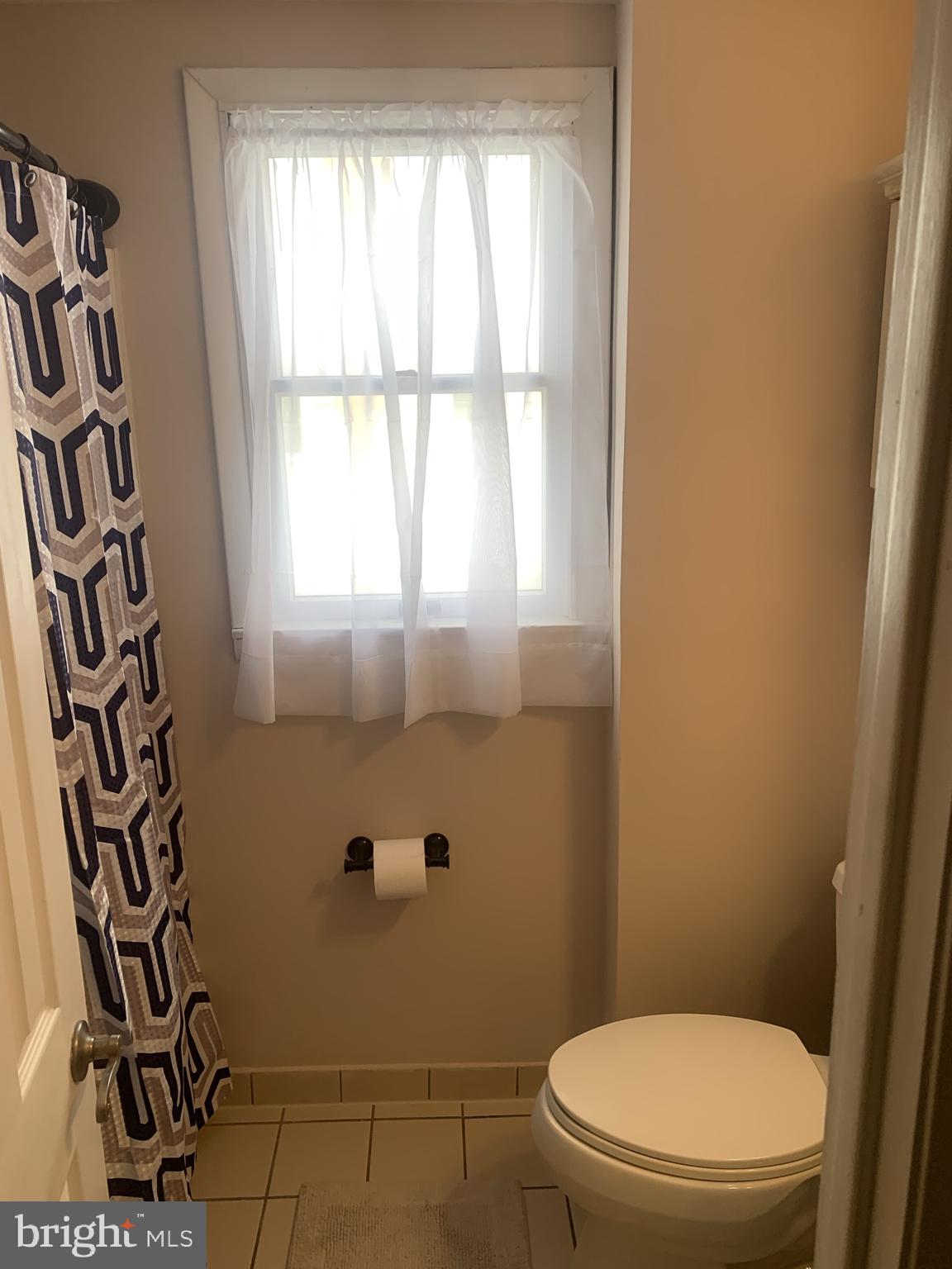 9902 Medway Road Philadelphia, PA 19115 - Photo 14 of 28 a bathroom with a toilet and a shower
