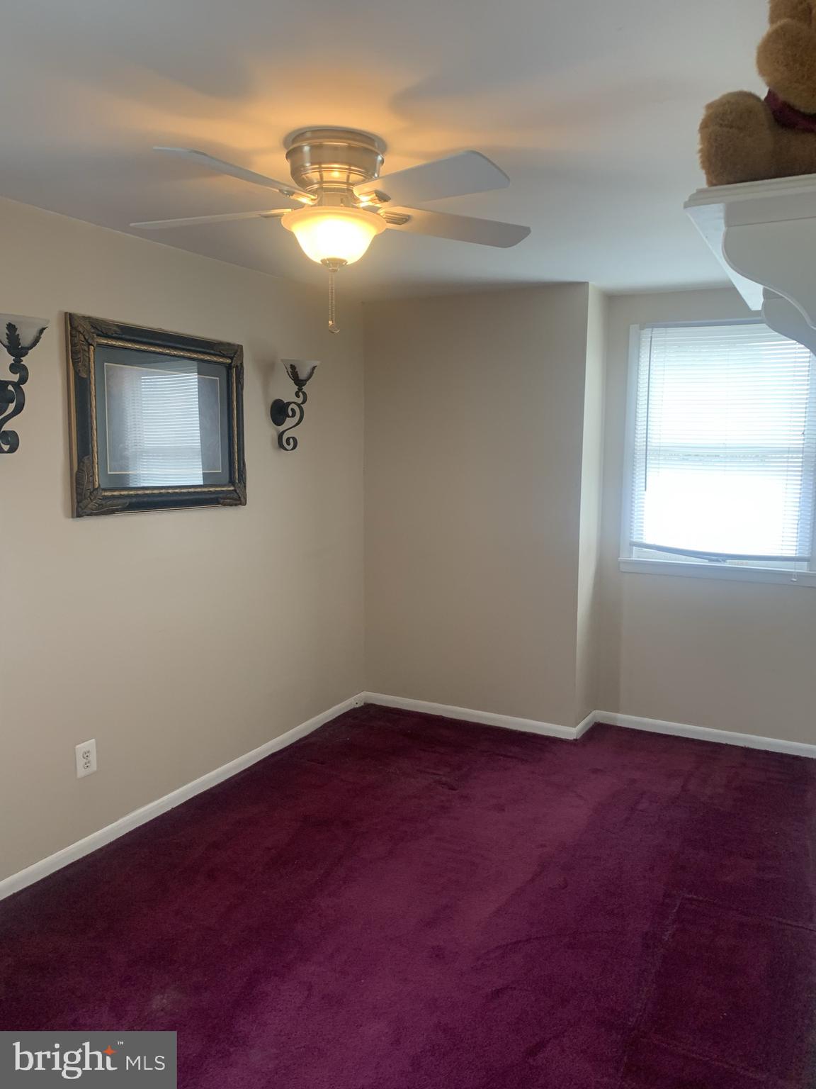 9902 Medway Road Philadelphia, PA 19115 - Photo 16 of 28 a view of an empty room with window and wooden floor