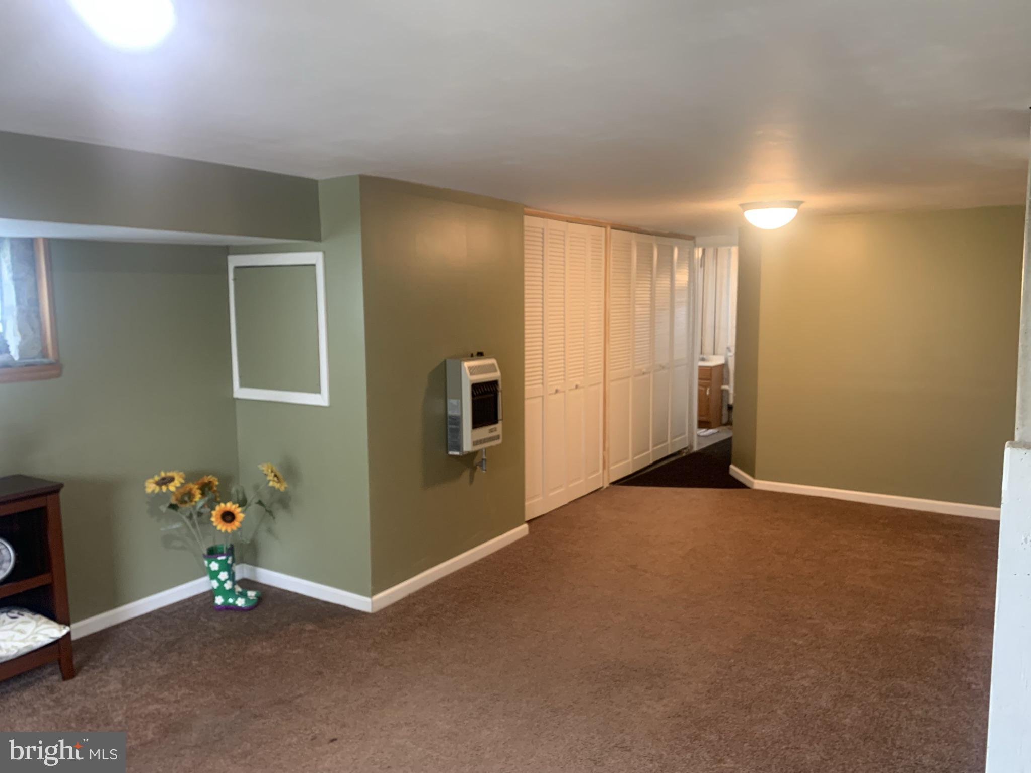9902 Medway Road Philadelphia, PA 19115 - Photo 20 of 28 an empty room with painting and stairs