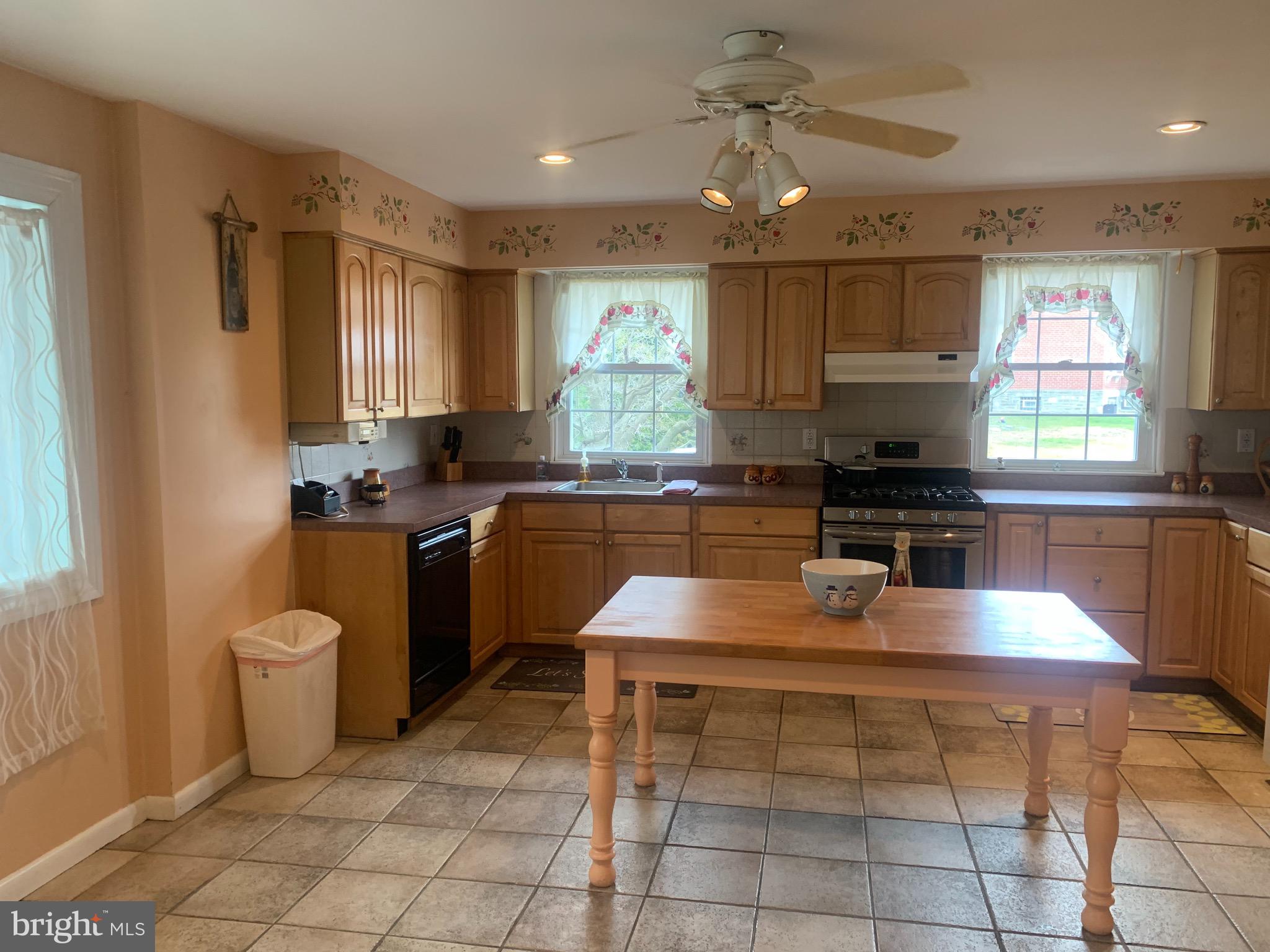 9902 Medway Road Philadelphia, PA 19115 - Photo 3 of 28 a kitchen with a sink white cabinets and appliances
