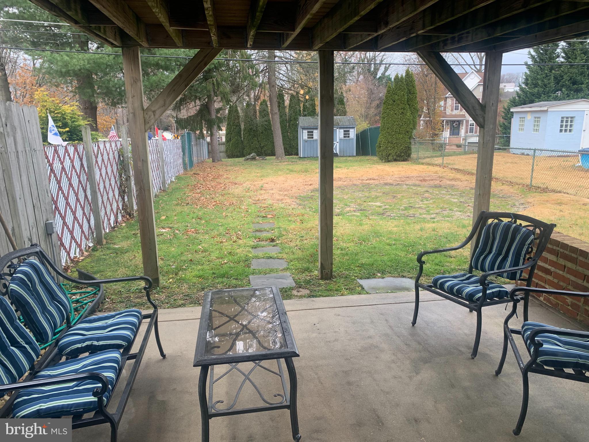 9902 Medway Road Philadelphia, PA 19115 - Photo 22 of 28 a view of a chair and tables in the patio