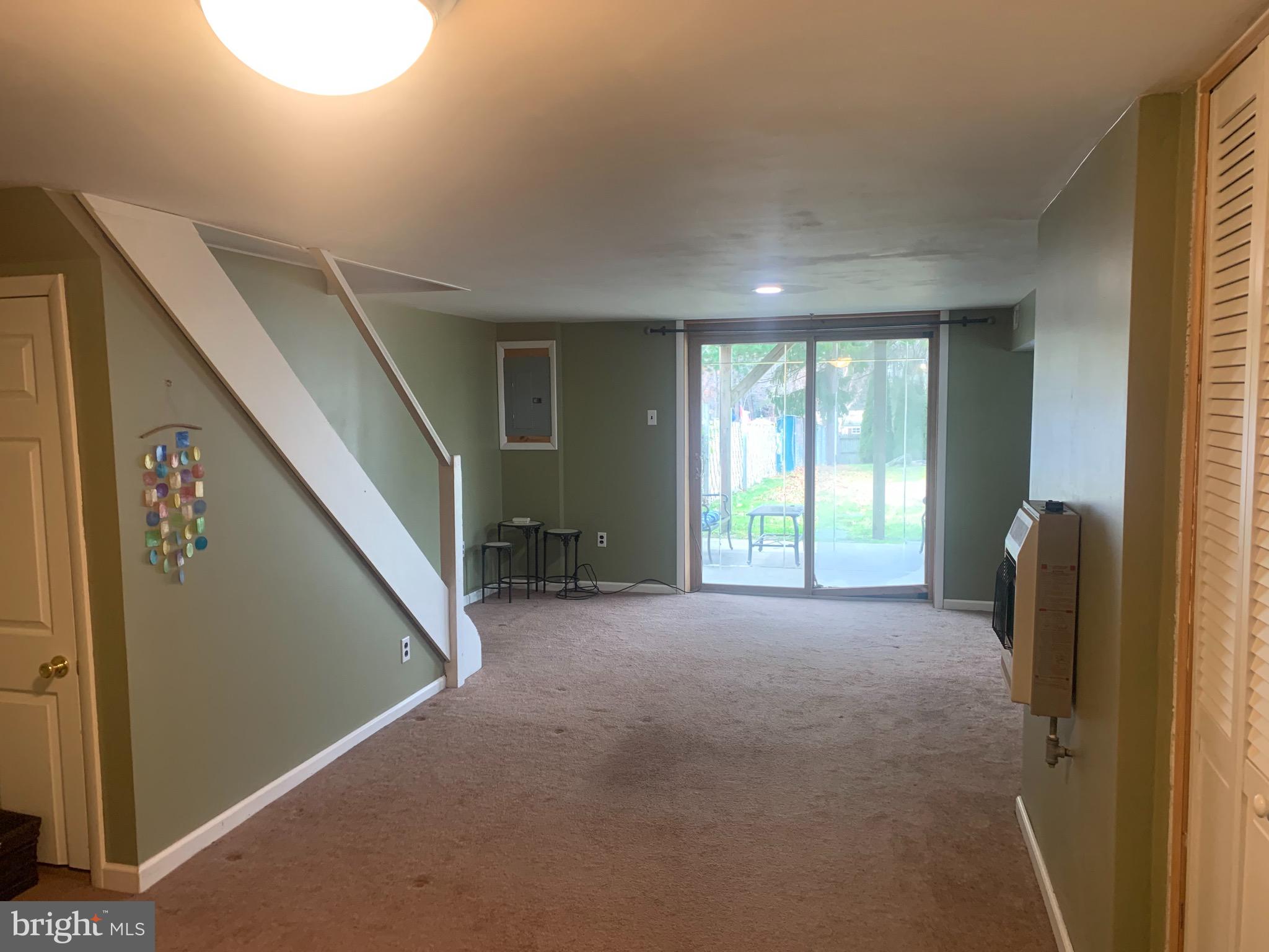 9902 Medway Road Philadelphia, PA 19115 - Photo 23 of 28 a view of a livingroom with an empty space and a window