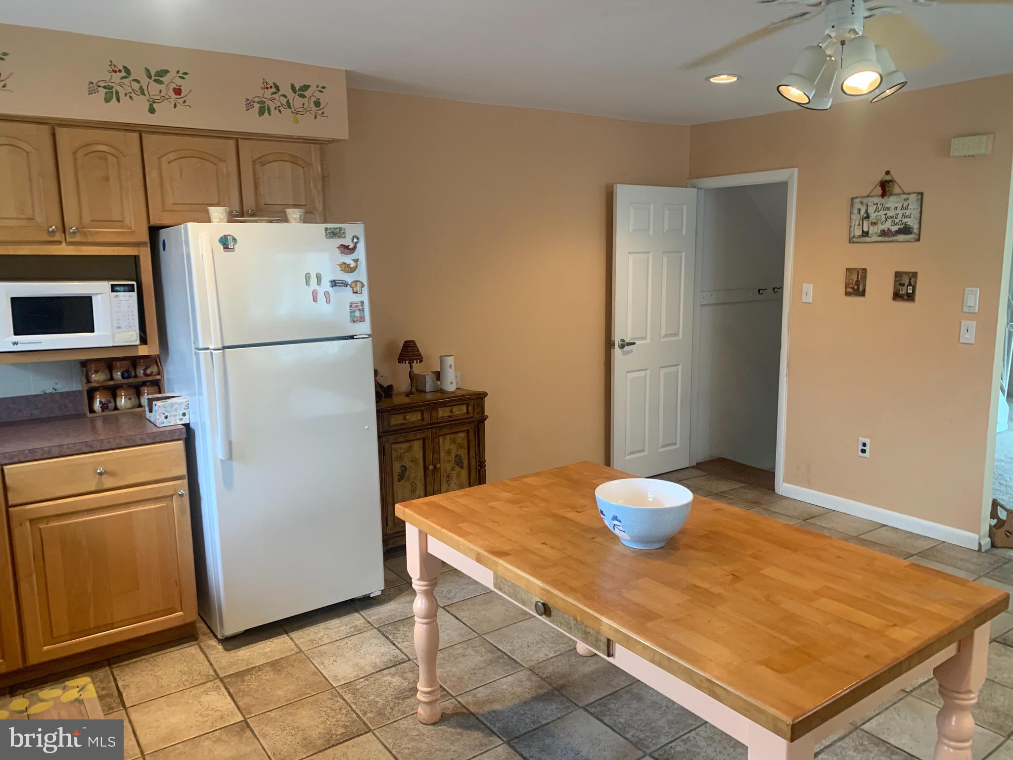 9902 Medway Road Philadelphia, PA 19115 - Photo 4 of 28 a kitchen with a refrigerator and microwave