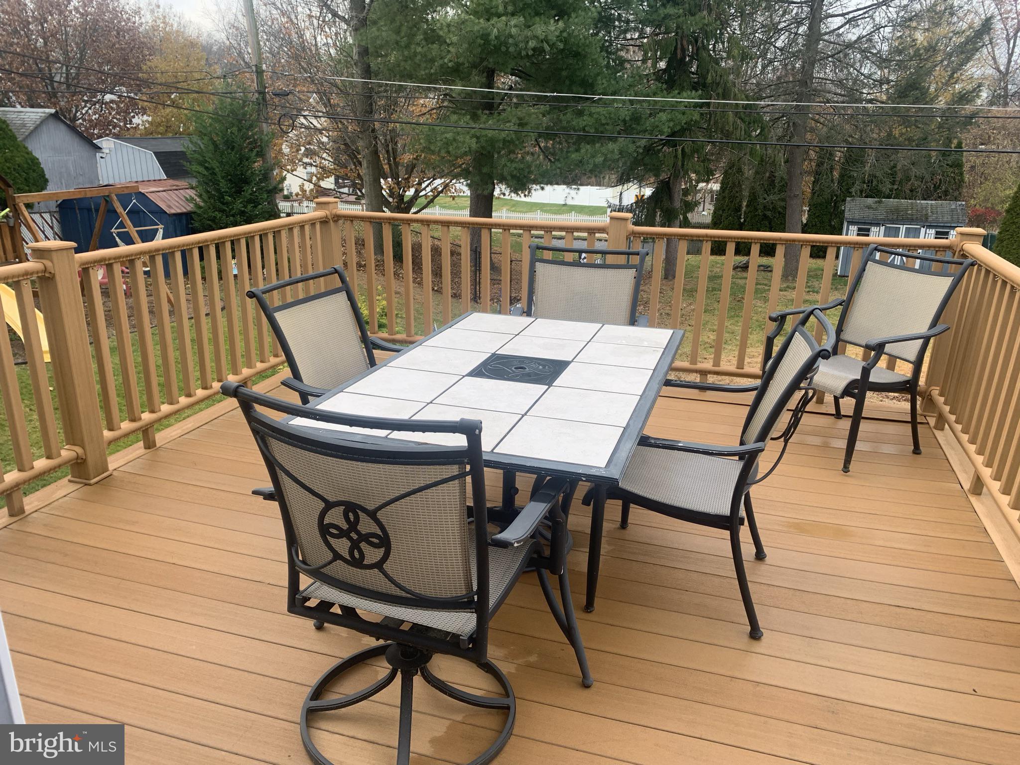 9902 Medway Road Philadelphia, PA 19115 - Photo 9 of 28 a view of a chairs and table on the deck