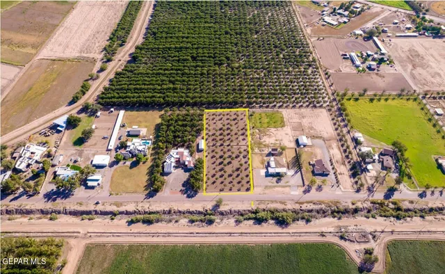 a view of a water fountain and a bench