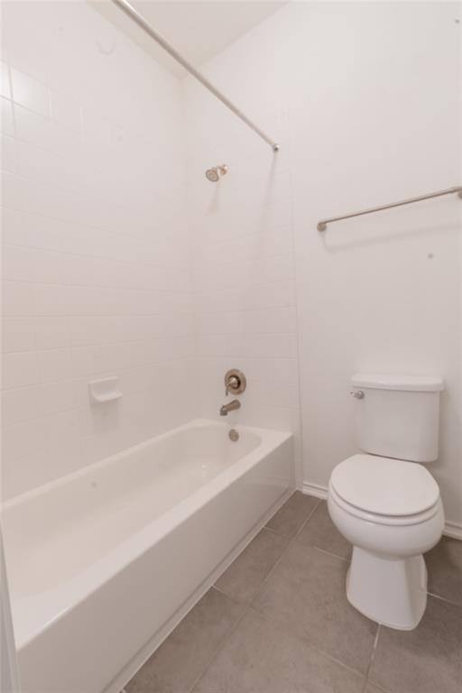 1333 Terrace View Drive Georgetown, TX 78628 - Photo 23 of 35 A well-maintained bathroom offers a classic white tub, shower, and toilet complemented by practical tiled flooring.