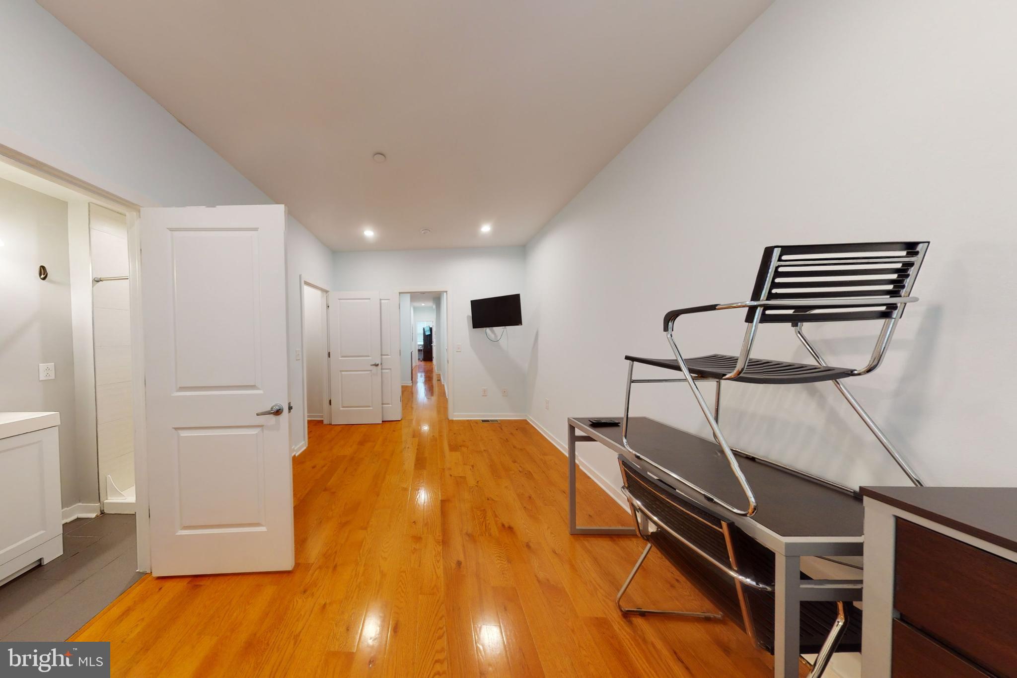 a bed room with a bed and cabinets