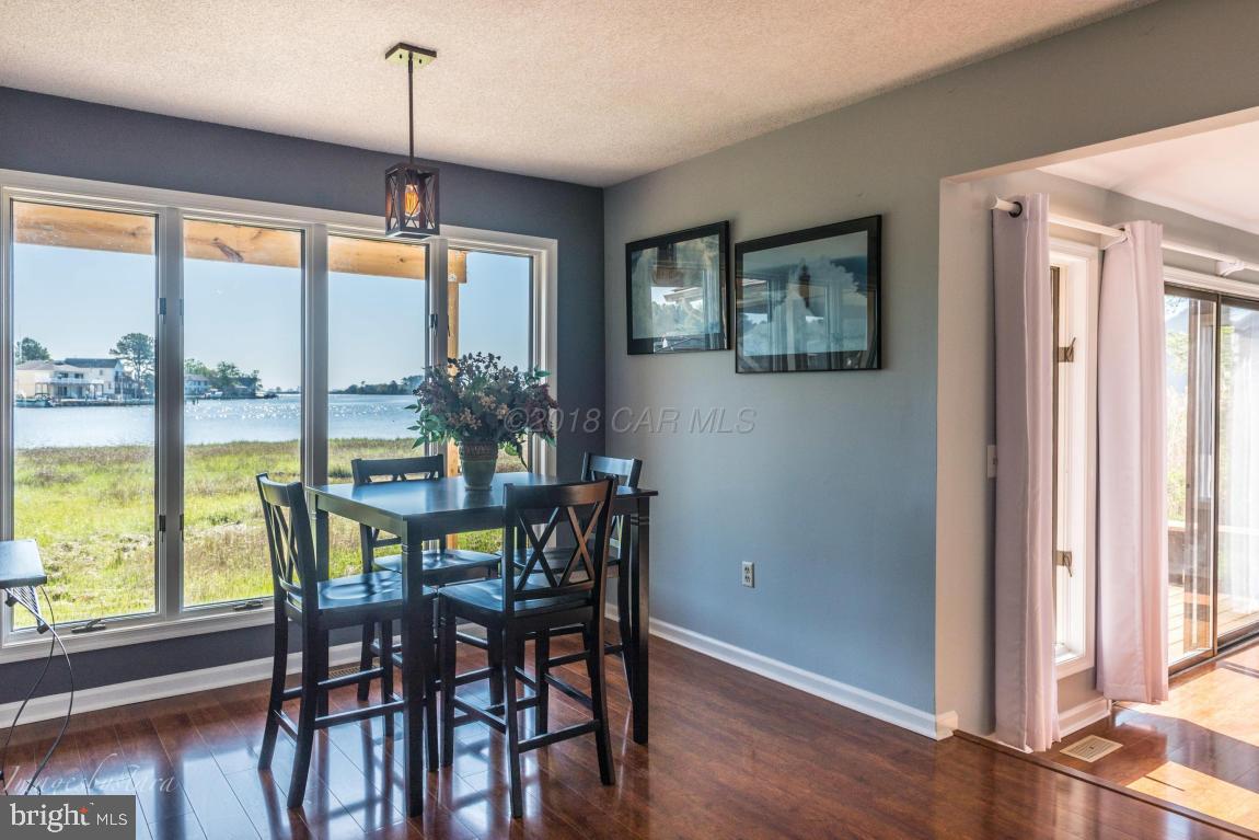 36 Saltgrass Road Ocean Pines, MD 21811 - Photo 15 of 70 a view of a dining room with furniture window and wooden floor