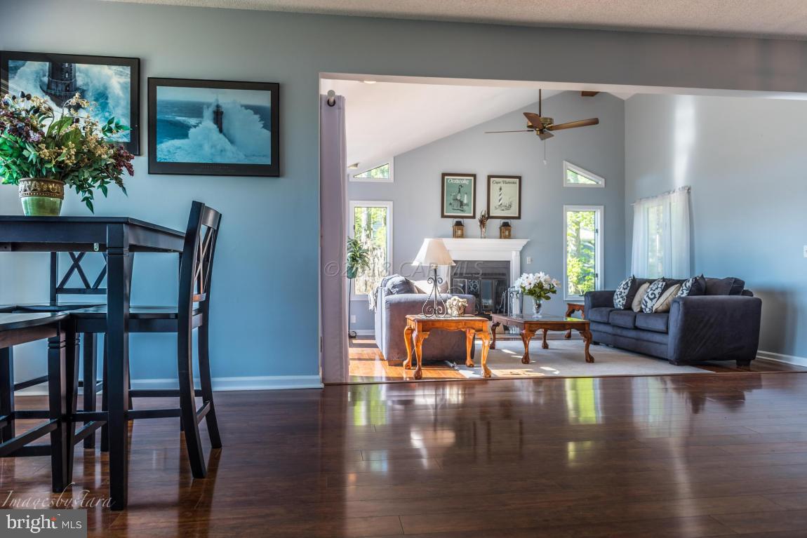 36 Saltgrass Road Ocean Pines, MD 21811 - Photo 16 of 70 a living room with fireplace furniture and a wooden floor