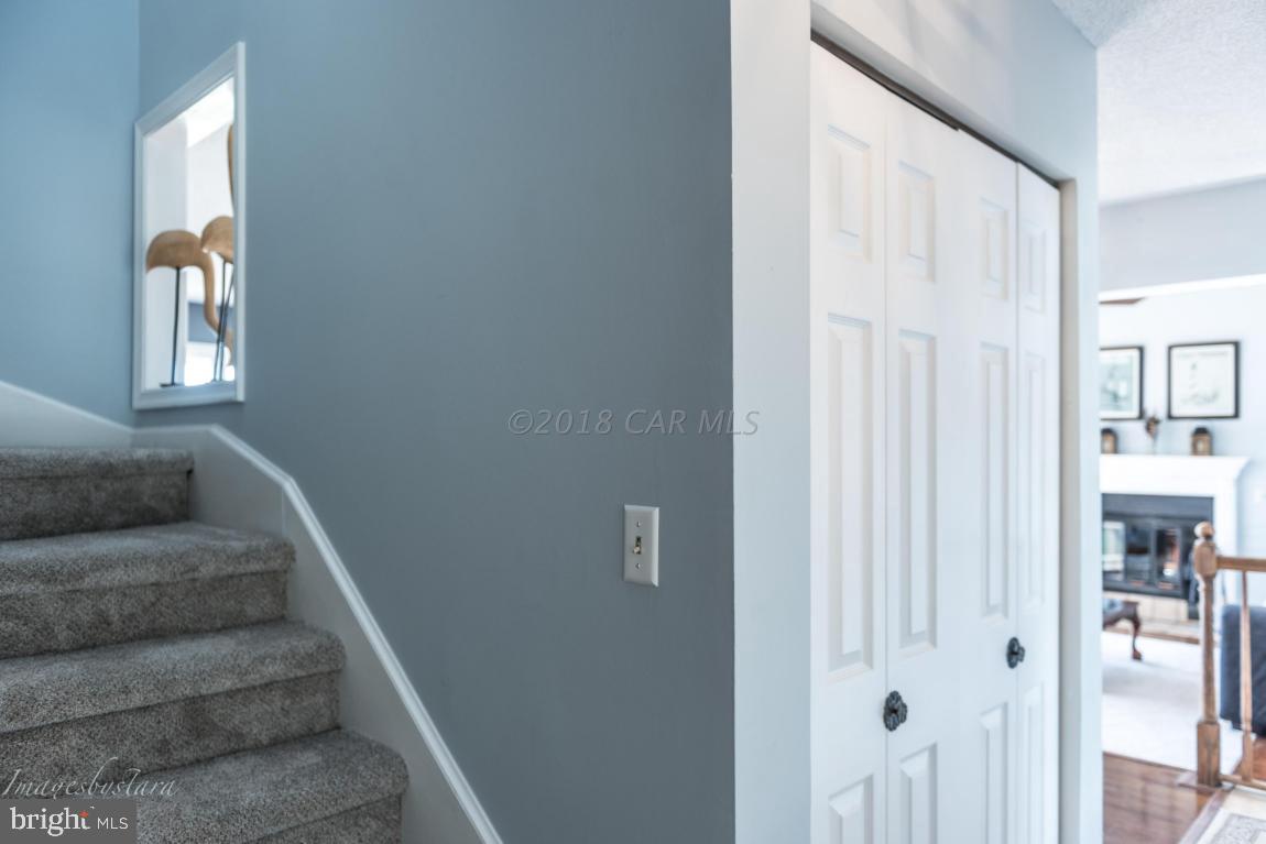 36 Saltgrass Road Ocean Pines, MD 21811 - Photo 22 of 70 a view of staircase with white walls and white door