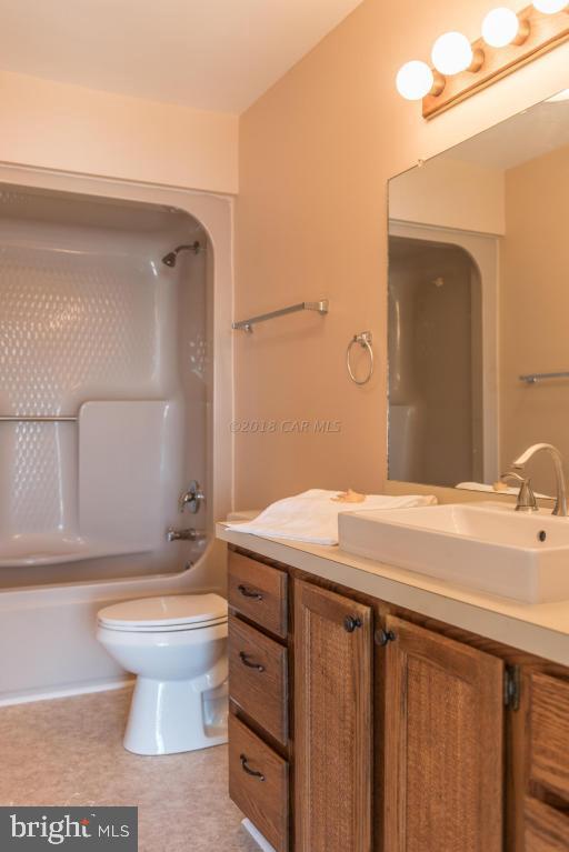 36 Saltgrass Road Ocean Pines, MD 21811 - Photo 47 of 70 a bathroom with a sink a toilet and mirror