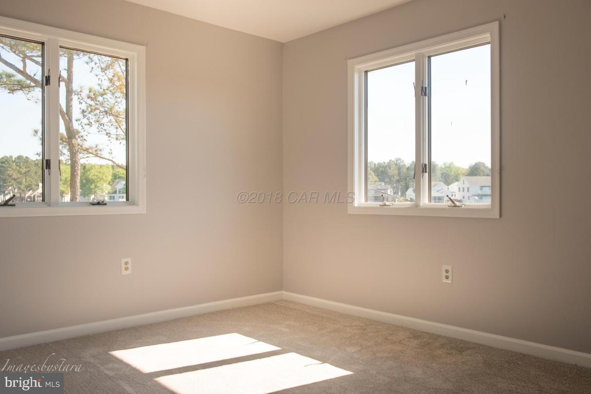 36 Saltgrass Road Ocean Pines, MD 21811 - Photo 49 of 70 an empty room with a window