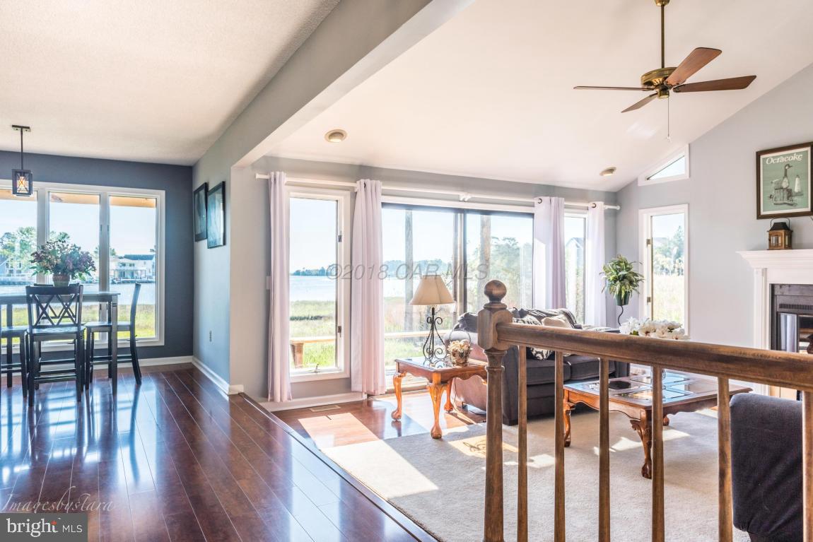 36 Saltgrass Road Ocean Pines, MD 21811 - Photo 6 of 70 a view of a room with wooden floor fan and windows