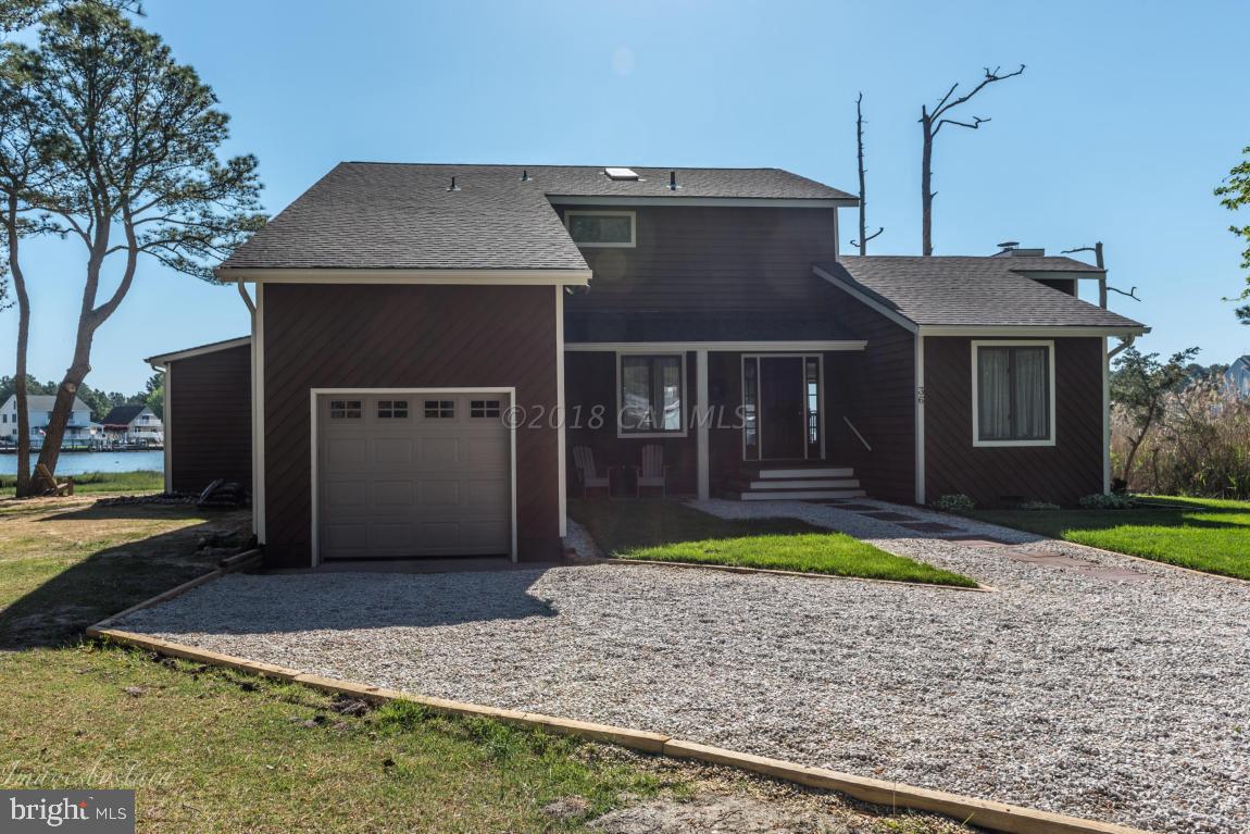 36 Saltgrass Road Ocean Pines, MD 21811 - Photo 57 of 70 a front view of a house with garden