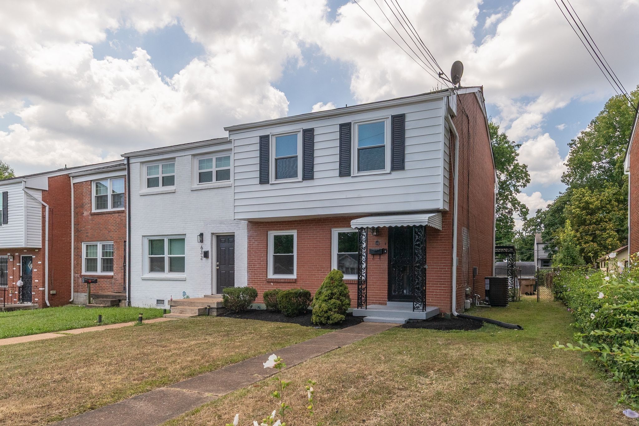 634 North 5th Street Nashville, TN 37207 - Photo 1 of 27 a view of a brick house with a large windows and a large tree