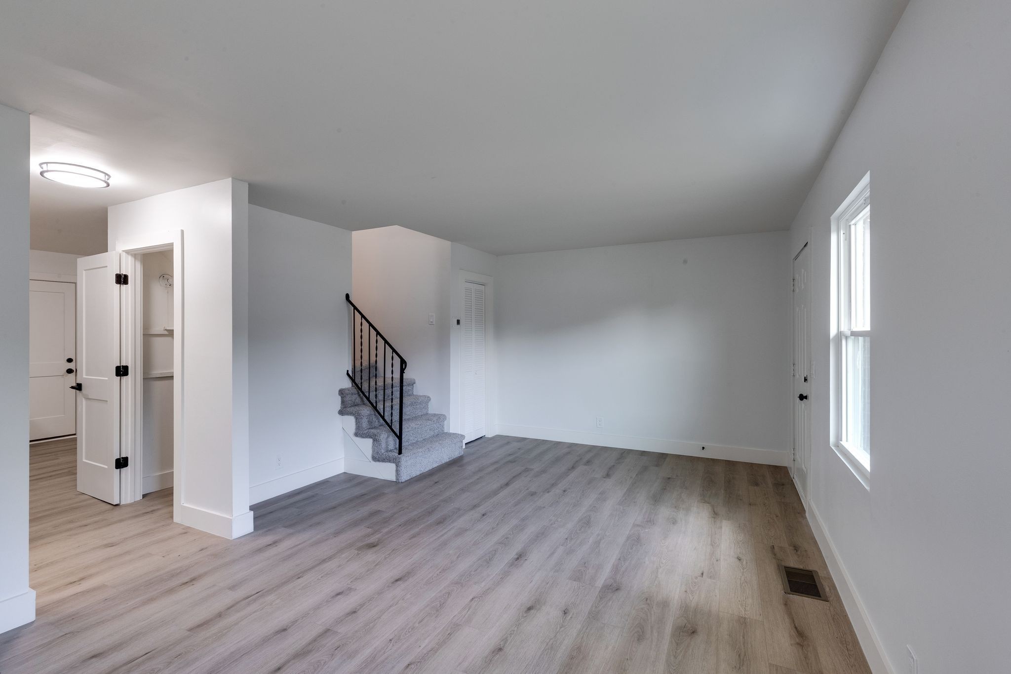 634 North 5th Street Nashville, TN 37207 - Photo 3 of 27 wooden floor in an empty room with a window