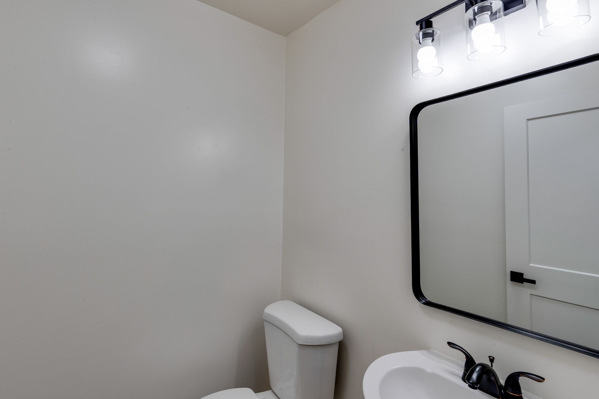 634 North 5th Street Nashville, TN 37207 - Photo 5 of 27 a white toilet sitting next to a bathroom sink