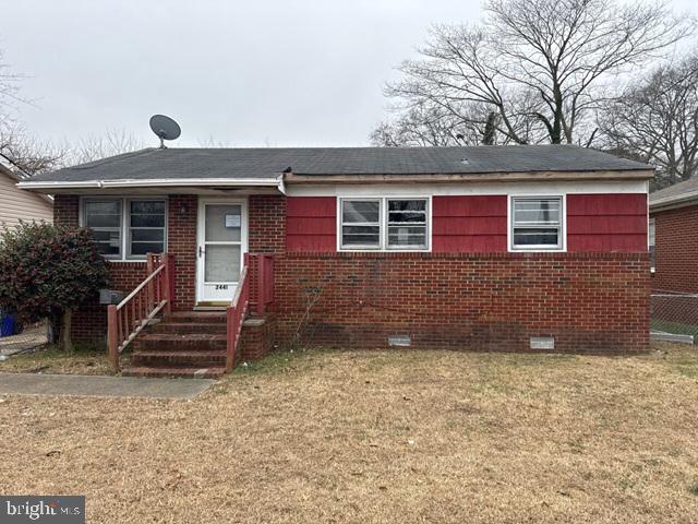 2441 Alder Street Norfolk, VA 23513 - Photo 1 of 11 a front view of a house with a yard