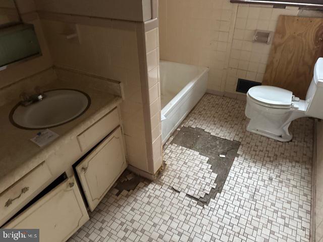 2441 Alder Street Norfolk, VA 23513 - Photo 11 of 11 a bathroom with a sink a toilet and shower