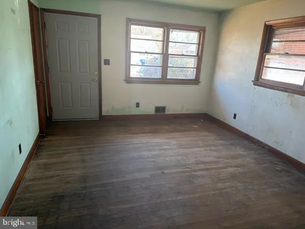 an empty room with windows